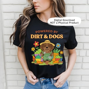 May include: Black t-shirt with the text "POWERED BY DIRT & DOGS" in orange and yellow. The graphic features a cartoon dog wearing a straw hat and overalls, holding a watering can, surrounded by potted plants and carrots.