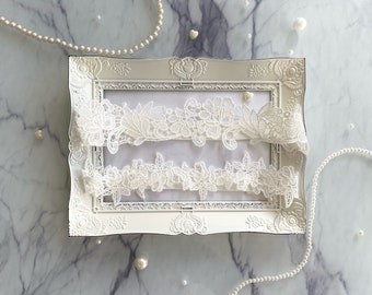 White bridal garter with lace flowers for wedding gift for bride