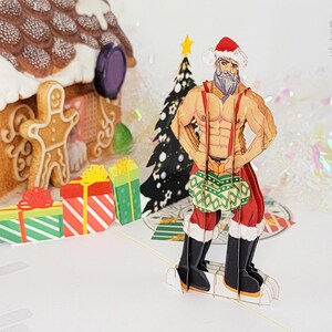 Funny Christmas Card | Pop Up Sexy Santa Claus holding Jingle Balls | Christmas Greeting Card Gift for Friends, Coworkers, Brother, Sister