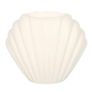 May include: A white ceramic seashell-shaped candle holder. The holder has a smooth, textured surface and a slightly rounded opening at the top.