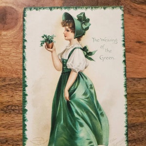 Ellen H Clapsaddle Postcard The Wearer of the Green Irish Girl, Green Bonnet, Green Four-Leaf Clover, Gold Embossed Holiday Card
