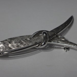 Marcel Boucher Vintage silver tone signed   knot brooch.