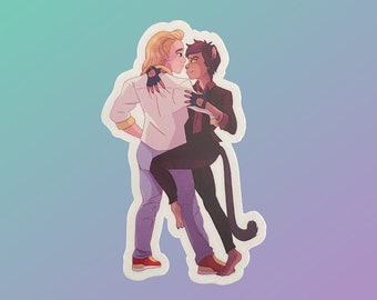 May include: A sticker featuring a digital illustration of two people dancing. The person on the left has blonde hair and is wearing a white shirt and blue jeans. The person on the right has brown hair and is wearing a black shirt and black trousers. The person on the right has a black cat tail.