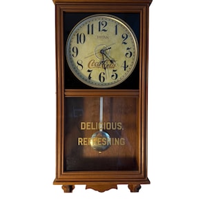 Vintage Coca-Cola Wall Clock with Pendulum – “Delicious Refreshing” Advertising Clock