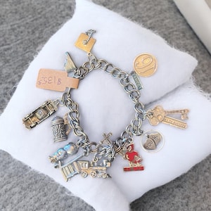 Vintage Sterling Charm Bracelet silver charms and bracelet with multiple charms over 44 grams of silver