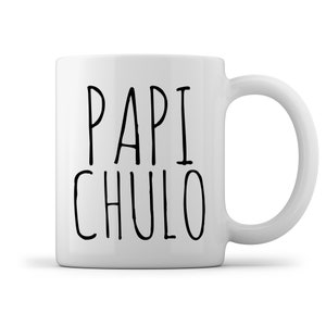 May include: White ceramic coffee mug with black text that reads "PAPI CHULO".