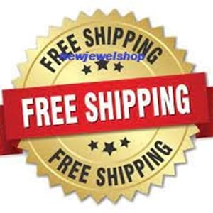 May include: A gold starburst with the text "FREE SHIPPING" in black lettering. The starburst has a red ribbon with the text "FREE SHIPPING" in white lettering.