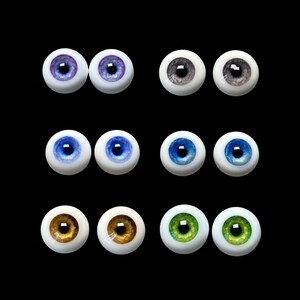 May include: Set of ten doll eyes in various colors, including blue, green, brown, and gray. The eyes are made of glass and have a realistic appearance.