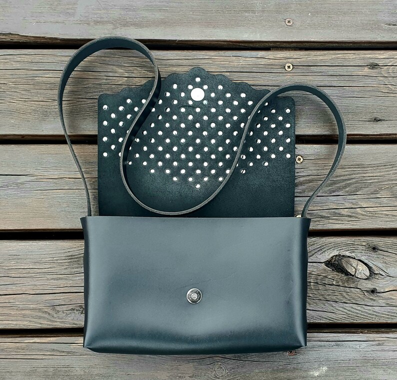 Black leather handbag with flakes