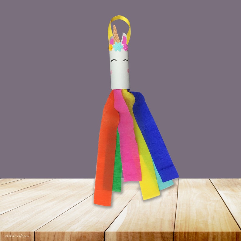 May include: A rainbow unicorn craft made from a cardboard tube with a unicorn face and a horn. The unicorn has a rainbow mane and tail made from crepe paper streamers.