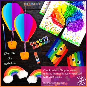 May include: A rainbow-themed craft kit with hot air balloons, a rainbow tree, a rainbow popsicle stick craft, and rainbow play dough. The kit includes paint, glue, and other craft supplies. "Cherish the Rainbow" is written on the image.