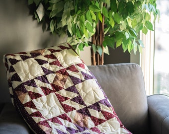 Multi colored 100% cotton quilt, This a lap quilt, with a cream minky backing for your extra warmth