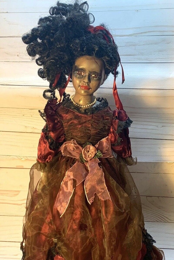 Creepy black doll sale