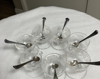 Vintage glass salt cellars with silver plated spoons.  Set of 7.