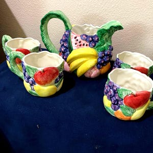 Vintage Fitz and Floyd calypso hand painted fruit pitcher and 4 mugs