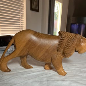 Vintage  hand carved wooden miniature Lion