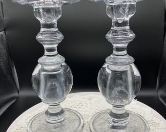 A pair of pillar glass candleholders
