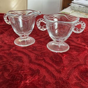 Vintage clear Fostoria Coronet Depression glass sugar and creamer set.