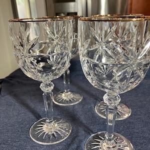 Vtg Avon lead crystal 10 oz. wine goblets with a gold rim. Set of 4.  Made in France.