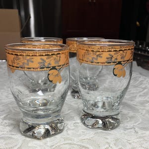 Vtg. Shot glasses hand blown with gold rim. Set of 4