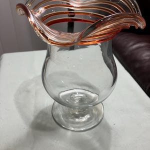 Vtg  clear glass hand blown vase with swirl edge and an amber trim