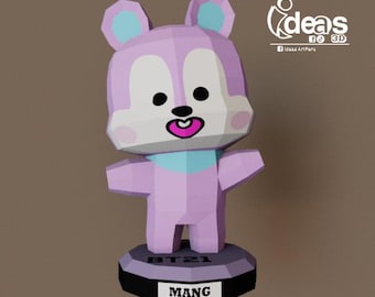 May include: A pink and blue 3D papercraft figurine of a cartoon character with a pacifier. The character is standing on a black base with the text "BT21" and "MANG" on it.