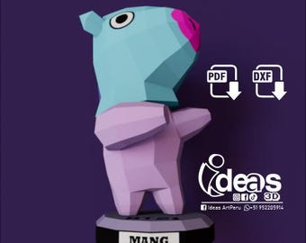 May include: A 3D papercraft model of a light blue and purple character with a pink nose and large black eyes. The character is standing on a black base with the word "MANG" printed on it. The image includes the text "ideas 3D" and icons for PDF and DXF files.