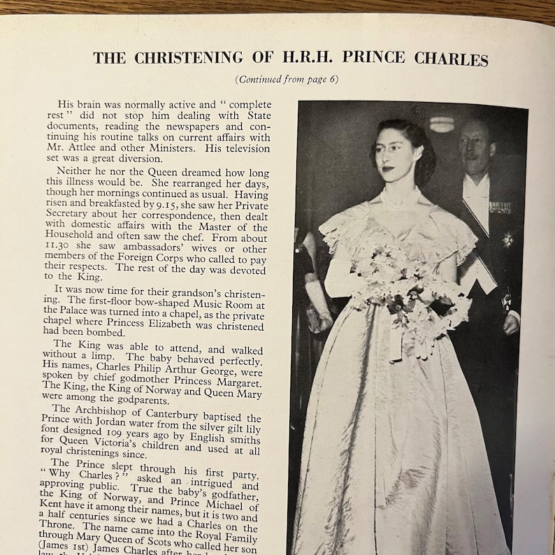 May include: A black and white photograph of a young Prince Charles being christened. The photo shows Prince Charles in a white gown with a lace collar and a crown on his head. The photo also shows the Queen, the King, and other members of the royal family.