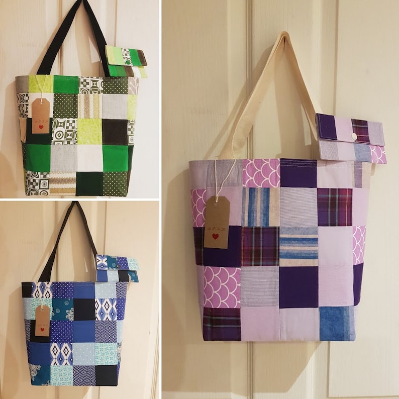 May include: Three patchwork tote bags with matching zippered pouches. The bags are made from different fabrics in shades of green, purple, and blue. Each bag has a brown tag with a red heart.