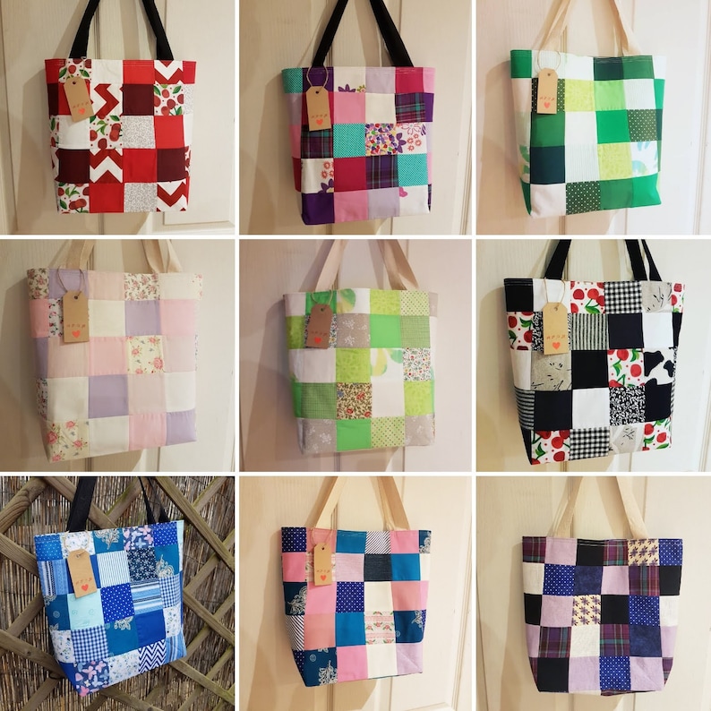 May include: Nine patchwork tote bags with different color combinations and patterns. The bags are made of fabric scraps sewn together in a checkered pattern. The bags have a simple design with a single handle.