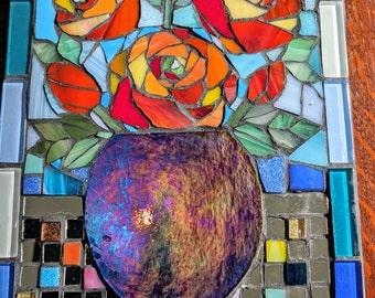 Large rose mosaic piece for display indoors or outdoors in a garden. Contains mirror pieces to catch the light.