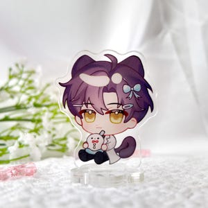 May include: A purple-haired anime character with cat ears and a blue bow, wearing a white lab coat and holding a small white plushie. The character is standing on a clear acrylic base.