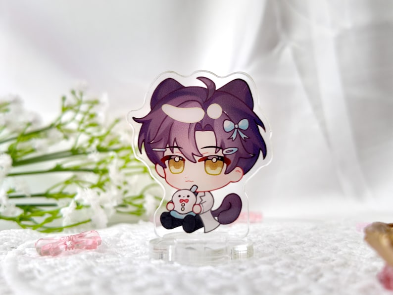 May include: A purple-haired anime character with cat ears and a blue bow, wearing a white lab coat and holding a small white plushie. The character is standing on a clear acrylic base.