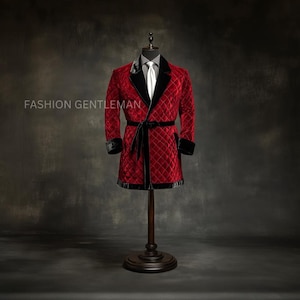 May include: A red quilted velvet robe with black velvet trim and a matching belt, displayed on a wooden mannequin. The robe has a diamond pattern and is paired with a white shirt and tie. The text "FASHION GENTLEMAN" is visible.