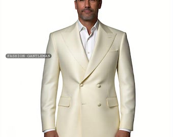 May include: A double-breasted suit jacket in a light cream color. The jacket has a peak lapel and six buttons down the front.