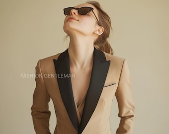 May include: A tan blazer with a black satin lapel and a single button closure. The blazer has a slim fit and is made of a smooth, luxurious fabric.