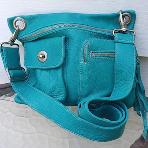 Vintage turquoise roots villager bagLeather excellent used condition/crossbody/free shipping