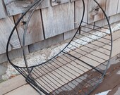Midcentury modern magazine rack firewood holder black iron hoop rack metal vintage 1970s retro free shipping prepaid tariff