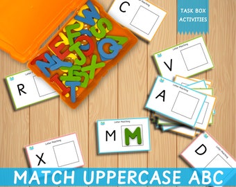 May include: A set of colorful uppercase letter matching cards with a box of foam letters. The cards have a letter printed on them and a blank space for the child to match the letter with the foam letter. The cards say "Letter Matching" and the box says "TASK BOX ACTIVITIES". The text at the bottom of the image says "MATCH UPPERCASE ABC".
