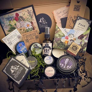 Beautifully curated gift box featuring Mischievous Potions products, natural deodorant, perfumes, candles, & original art. Ideal for lovers of handcrafted, eco-friendly self-care items. Whimsical gift for nature enthusiasts & magical apothecary fans