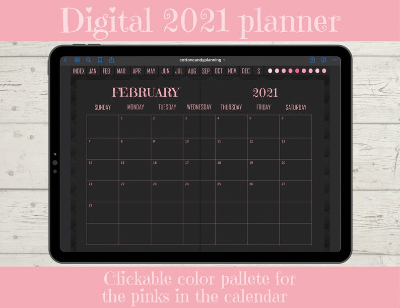 May include: A digital planner for February 2021 on a tablet screen. The calendar has a black background with pink text and a pink border. The calendar is displayed on a wooden surface.