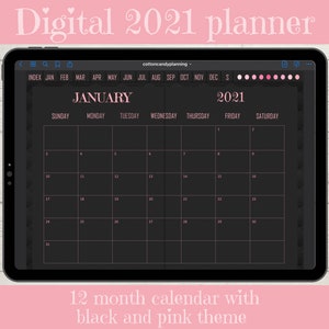 May include: A digital planner for the year 2021 with a black and pink theme. The planner is displayed on a tablet screen and shows the month of January with the days of the week labeled. The planner includes an index for each month of the year.