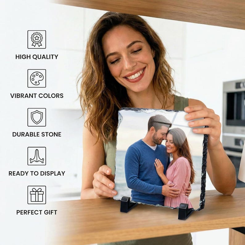 May include: A square photo slate plaque featuring a printed image of a couple embracing. The plaque has rough, natural stone edges and is supported by two black plastic stands. Text on the left reads: HIGH QUALITY, VIBRANT COLORS, DURABLE STONE, READY TO DISPLAY, PERFECT GIFT.