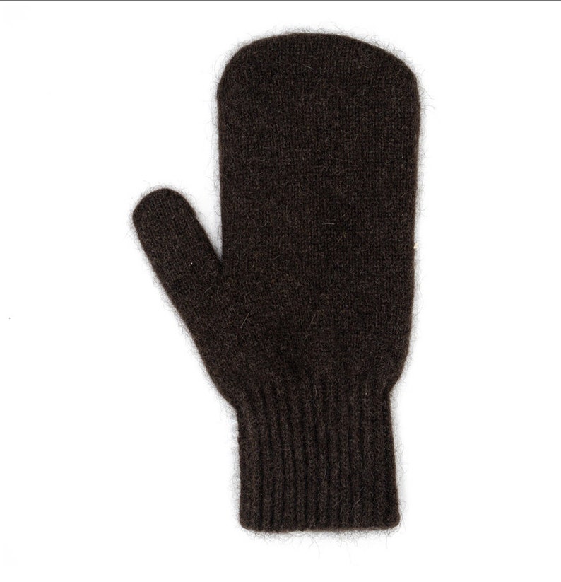 May include: A pair of brown knitted mittens with a fold-over cuff.