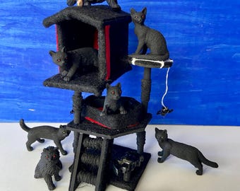 May include: A black cat tree with multiple levels, including a house, a scratching post, and a platform. Seven black cats are posed on and around the cat tree.