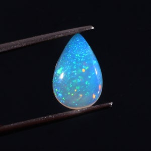 Natural Ethiopian Fire Opal Pear Shape Cabochon Celebrated Size 8x12mm Blue Dot Fire Opal Loose Gemstone For Making Jewelry 1.30 Cts.