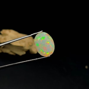 Stunning Top Grade Quality White Natural Fire Ethiopian Opal Oval Shape Faceted  Loose Gemstone Rainbow Fire Opal  Use For Making Jewelry