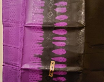 May include: Purple and black fabric with a geometric pattern and a label that says "GALANT" in white letters.