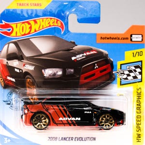 May include: A black and red 2008 Lancer Evolution die-cast toy car with gold wheels. The car has "ADVAN" and "PIAA" logos on the sides. The car is in a plastic display case with a blue background and the words "Hot Wheels" and "Track Stars" on the top.