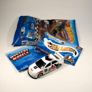 Hot Wheels Mitsubishi Lancer Evolution IX - Modelos Mistery 2024 (Vem em embalagem lacrada)